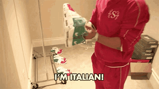 a person in a red outfit says i 'm italian while holding a pair of shoes