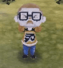 a pixelated cartoon character wearing glasses and a shirt that says r on it