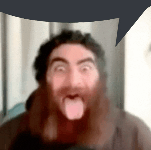 a man with a beard sticking his tongue out in front of a speech bubble