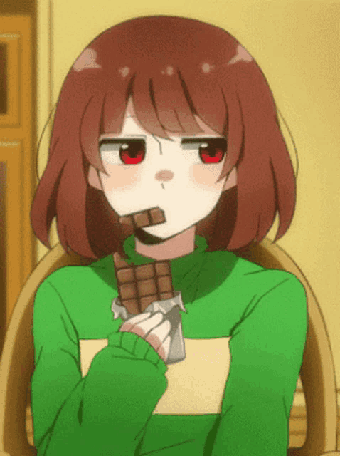 a girl with red eyes is holding a chocolate bar in her hand