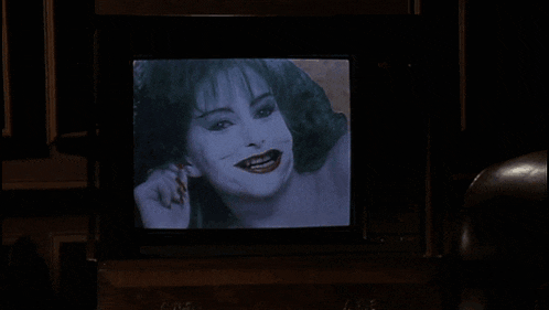 a television with a picture of a woman and the words love that joker on it