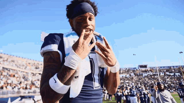 a football player wearing a headband and number 1 on his jersey