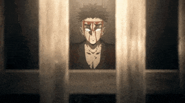 a man with blood on his face is behind a wooden fence .