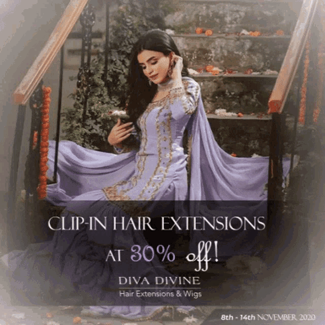 a woman in a purple dress sits on a set of stairs advertising clip-in hair extensions