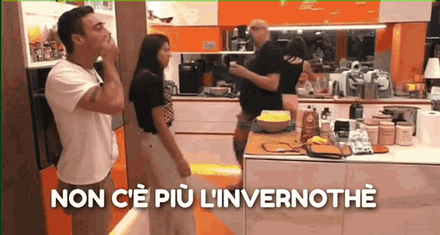 a group of people are standing in a kitchen with the words non c'e più l'invernothe written on the bottom