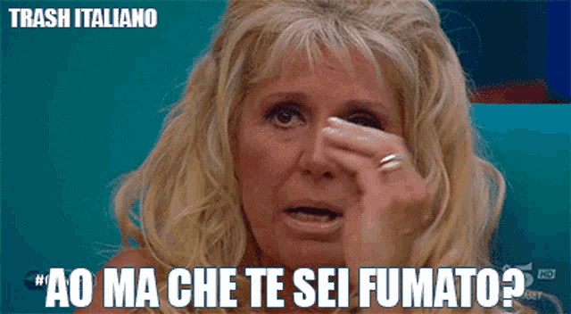 a woman covering her nose with her hand and the words trash italiano above her