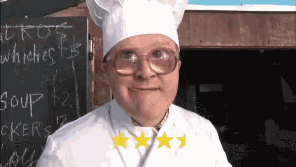 a man wearing a chef 's hat and glasses is standing in front of a blackboard with the word soup written on it