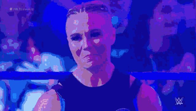 a pixelated image of a wrestler with the letters w on the bottom right
