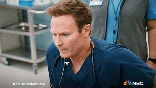 a man in a scrub with a stethoscope around his neck is on nbc 's st denis medical
