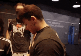 a man wearing a black shirt that says " the dream of content delivered "