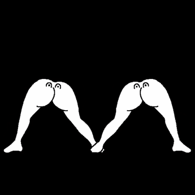 a couple of white birds kissing with a red heart above them .