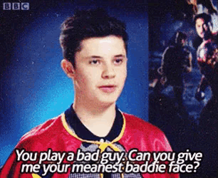 a young man in a red shirt says you play a bad guy can you give me your meanest baddie face ?