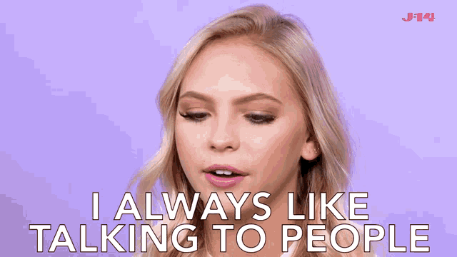 a woman says i always like talking to people in front of a purple background