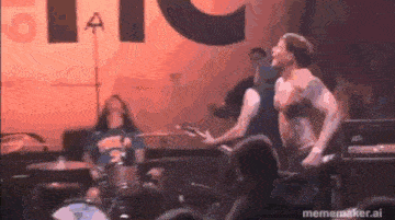 a group of men are playing instruments on a stage .