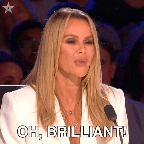 a woman speaking into a microphone with the words oh brilliant behind her