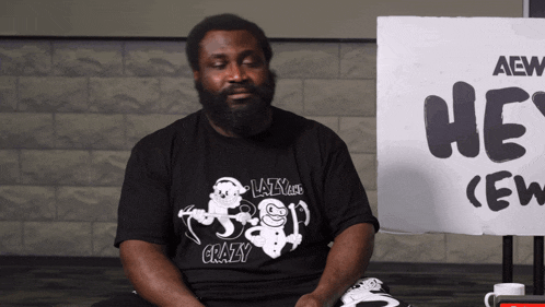 a man wearing a black shirt that says crazy
