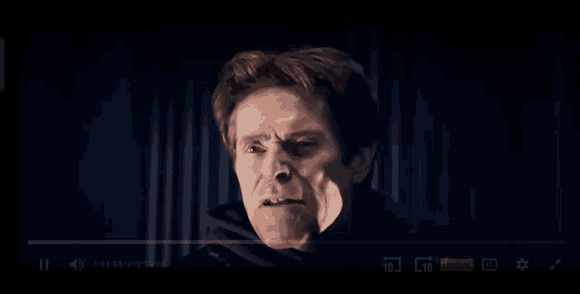 a close up of a man making a face with his mouth open