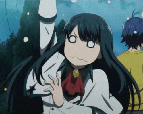a girl with black hair making a funny face with her eyes closed
