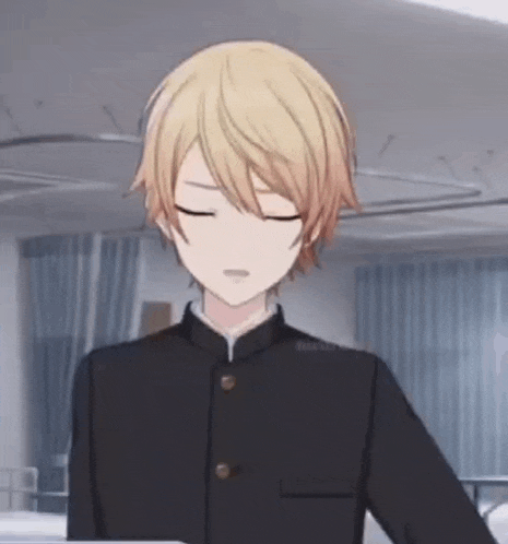 a young boy with blonde hair is standing in a room with his eyes closed and wearing a black uniform .