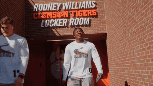 rodney williams clemson tigers locker room with two athletes