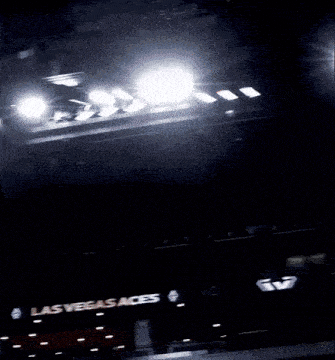 a sign that says las vegas aces is lit up in the dark