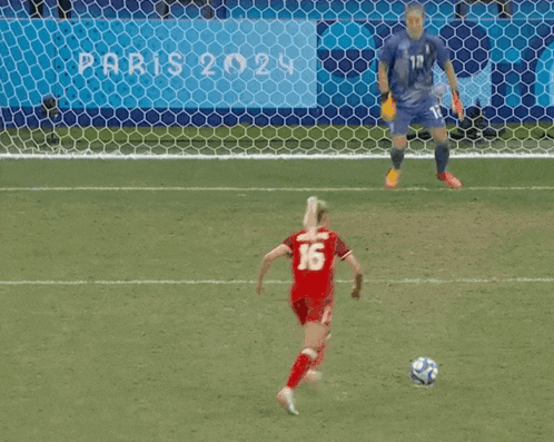 a soccer player wearing a number 16 jersey stands on the field