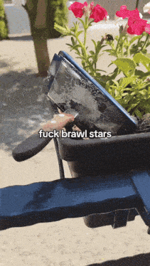 a broken phone in a flower pot with the words fuck brawl stars written below it