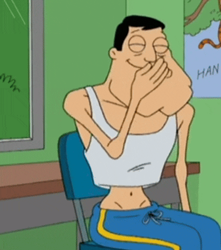 a man in a white tank top is covering his mouth with his hand in front of a poster that says han