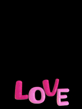 a man and a woman are standing next to each other with the word love in the foreground