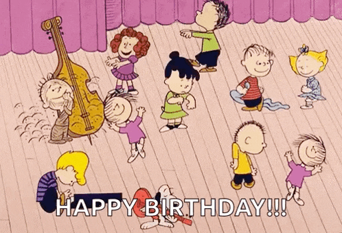 a group of peanuts characters are dancing on a stage in a happy birthday greeting .