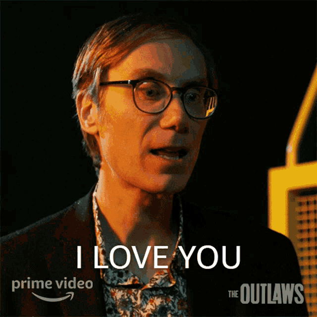 a man with glasses says " i love you " on a poster for the outlaws
