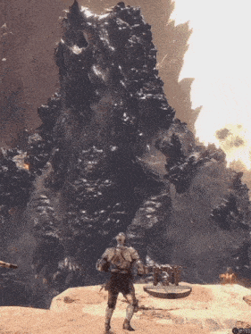 a man in armor stands in front of a large rock formation in a video game scene