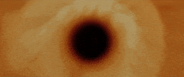 a close up of a black hole in a tunnel
