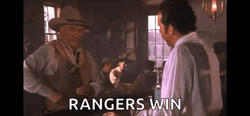 a man in a cowboy hat is talking to another man in a bar and the words `` rangers win '' are visible .