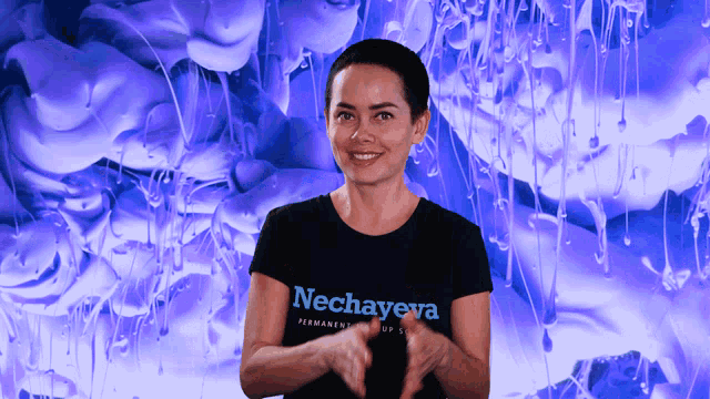 a woman wearing a black shirt that says nechayeva on it