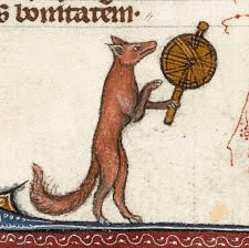 a fox is standing on its hind legs and holding a fan in its paws .