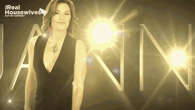 a woman in a black dress is standing in front of a sign that says real housewives