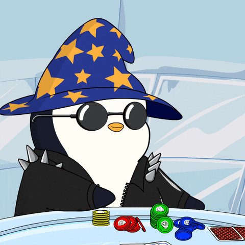 a penguin wearing a wizard hat and sunglasses sits at a poker table