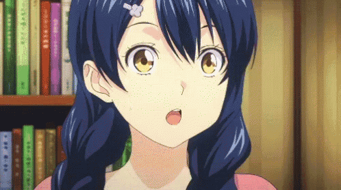 a girl with blue hair and yellow eyes is standing in front of a bookshelf with books on it .