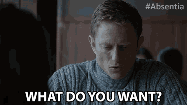 a man in a grey sweater is asking what do you want