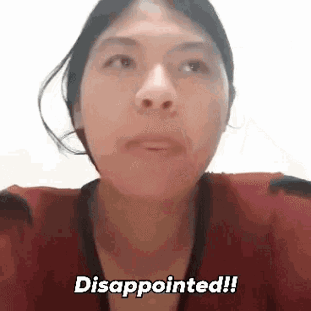 a close up of a woman 's face with the words disappointed written on it .