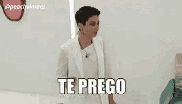 a woman in a white suit says te prego in black letters