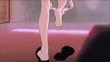 a person taking off their pants in a room