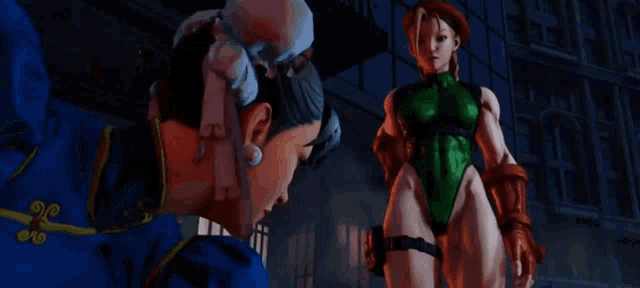 a woman in a blue dress is standing next to a man in a red costume