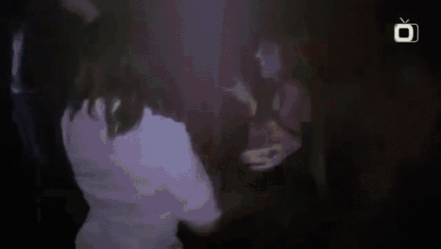 a man is boxing in front of a mirror .