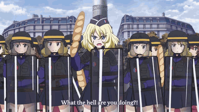 a girl holding a loaf of bread stands in front of a row of riot police holding shields