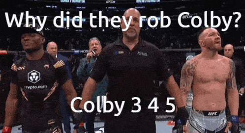 a man stands in front of a crowd with the words why did they rob colby on the bottom