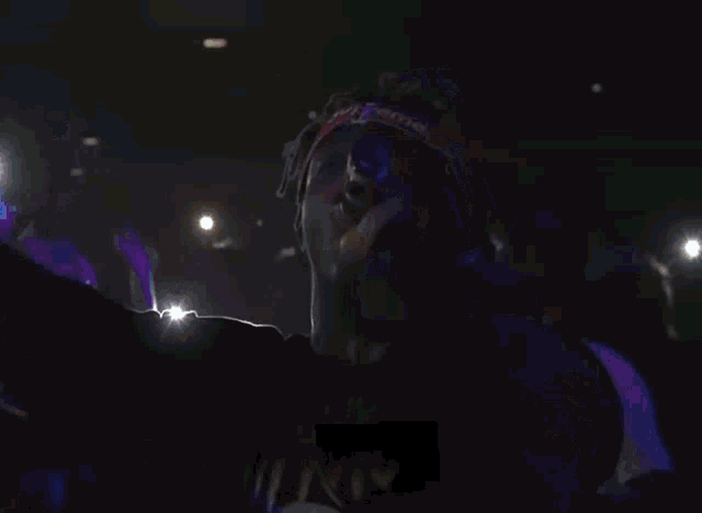 a man wearing a headband that says supreme on it
