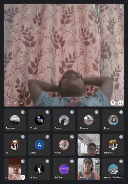 a group of people are on a video call and one of them has the letter a on their face
