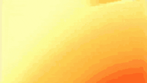 a close up of a yellow and orange colored surface